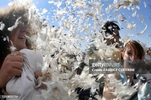 People attend a flash-mob pillow fight during the International Pillow Fight Day on April 2, 2011 in Zurich. Over 130 cities around the world are due...