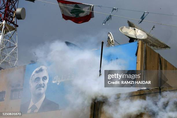 Smoke billows from the burning building of the pro-government Future TV, owned by the family of Lebanon's assasinated ex-premier Rafiq Hariri , in...