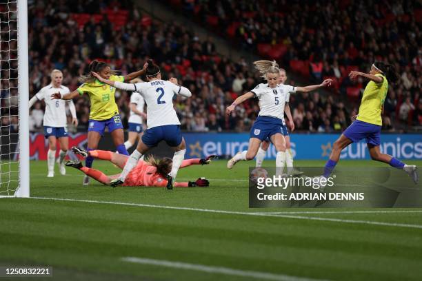 Brazil's forward Andressa Alves shoots and scores her team first goal during the "Finalissima" International football match between England and...
