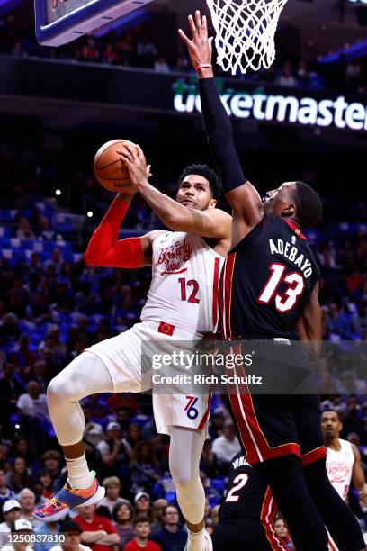 Tobias Harris of the Philadelphia 76ers goes up for a shot against Bam Adebayo of the Miami Heat during the first half at Wells Fargo Center on April...