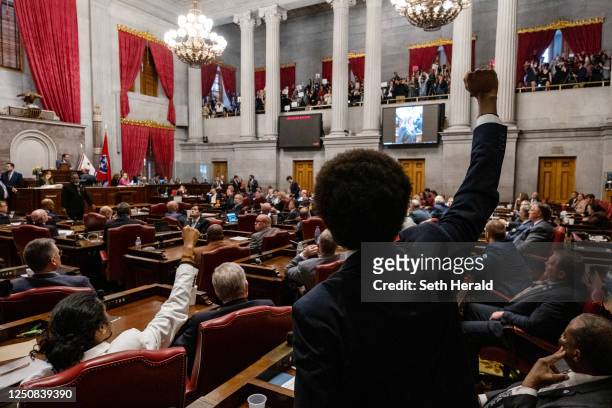 Democratic state Reps. Justin Jones of Nashville and Justin Pearson of Memphis gesture to supporters during the vote in which they were expelled from...