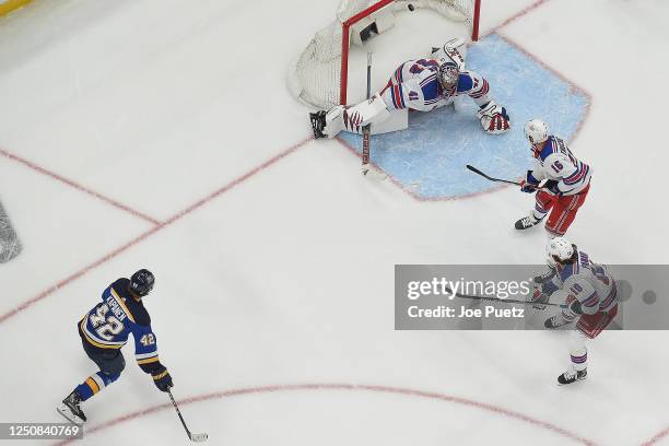 Kasperi Kapanen of the St. Louis Blues scores the game winning goal in overtime past Jaroslav Halak of the New York Rangers at the Enterprise Center...