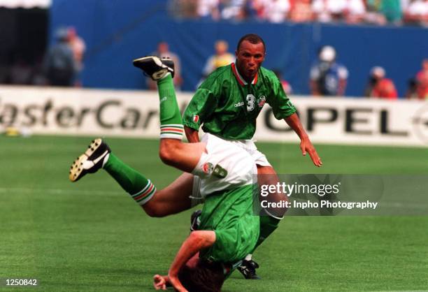 Teammate TERRY PHELAN LOOKS ON DURING IRELAND's 1-0 VICTORY OVER ITALY IN THE 1994 WORLD CUP GAME AT THE MEADOWLANDS+ GIANTS STADIUM IN EAST...