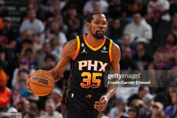 Kevin Durant of the Phoenix Suns moves the ball during the game against the Denver Nuggets on April 6, 2023 at the Ball Arena in Denver, Colorado....