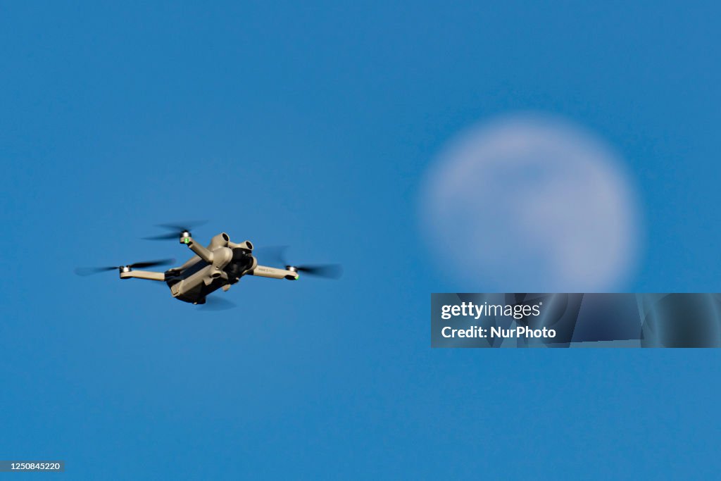 A Pro Consumer Drone As Seen In Front Of The Moon
