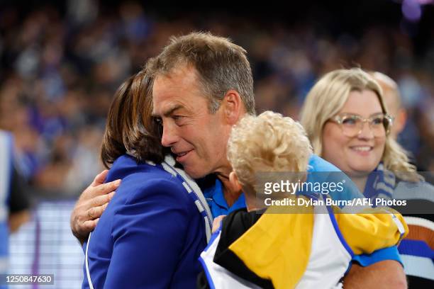 Alastair Clarkson, Senior Coach of the Kangaroos hugs Sonja Hood, President of the North Melbourne FC during the 2023 AFL Round 04 match between the...