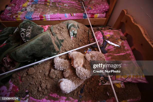 Toy panda is seen in a destroyed house after Israel launched air strikes on the Palestinian enclave early on April 7, 2023. - Israel launched air...