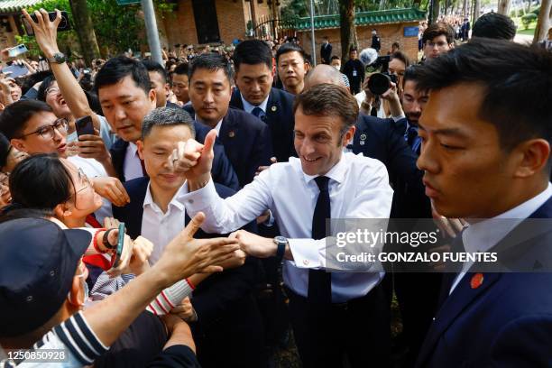 French President Emmanuel Macron arrives for a visit at Sun Yat-sen University in Guangzhou on April 7, 2023.