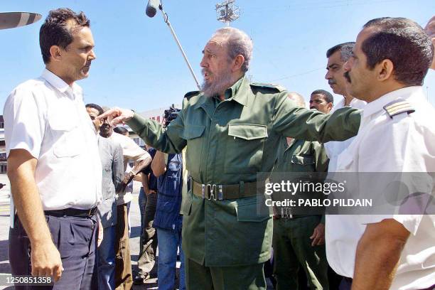 Cuban President Fidel Castro greets 22 March 2003 in Havana passengers and crew who were aboard a Cuban plane hijacked earlier in the week to...