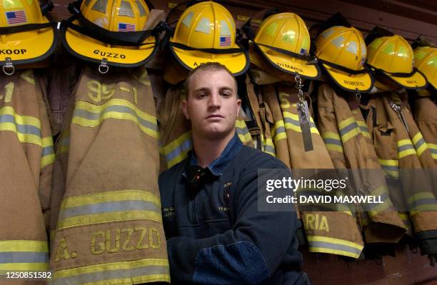 Andrew Guzzo, a rescue worker with the Citizens Volunteer Fire Company of Arnold, Pennsylvania, poses at the fire department in Arnold, Pennsylvania...