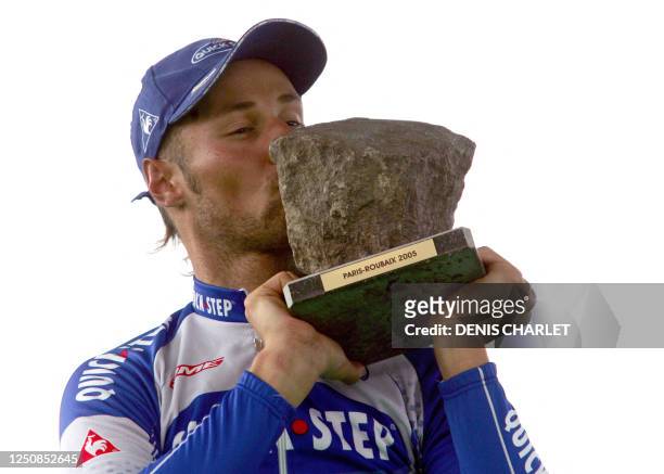Belgian Tom Boonen kisses his trophy on the podium of the 103d Paris-Roubaix cycling race, 10 April 2004 in Roubaix. He won the race ahead of US...