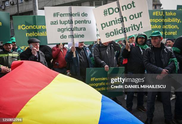 Romanian farmers protest in the front of the European Commision headquarters in Bucharest on April 7, 2023. - Farmers gather on a national-wide...