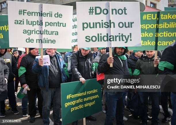 Romanian farmers protest in the front of the European Commision headquarters in Bucharest on April 7, 2023. - Farmers gather on a national-wide...