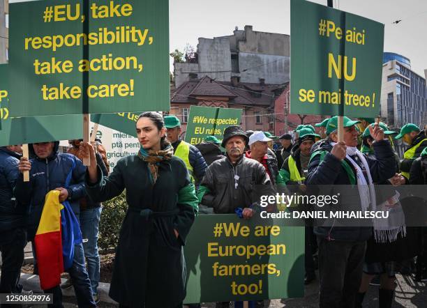 Romanian farmers protest in the front of the European Commision headquarters in Bucharest on April 7, 2023. - Farmers gather on a national-wide...