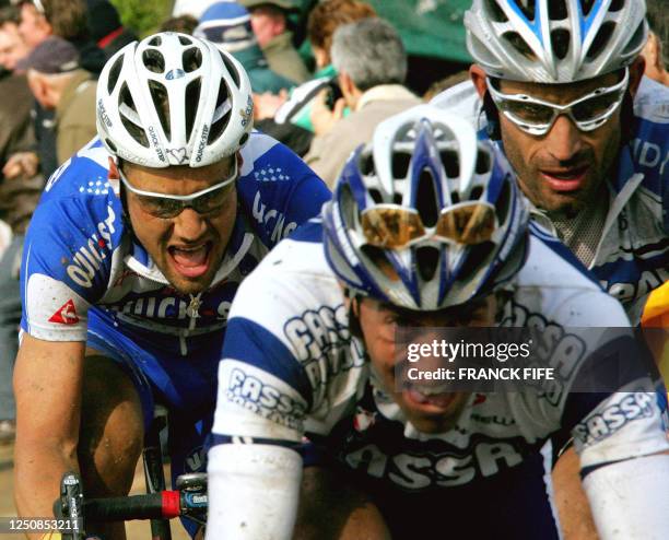 Belgian Tom Boonen , Spanish Juan Antonio Flecha and US George Hincapie ride in the leading pack during the 103rd Paris-Roubaix cycling race, 10...