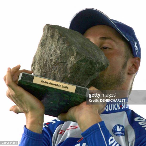 Belgian Tom Boonen kisses his trophy on the podium of the 103rd Paris-Roubaix cycling race, 10 April 2005 in Roubaix. He won the race ahead of US...