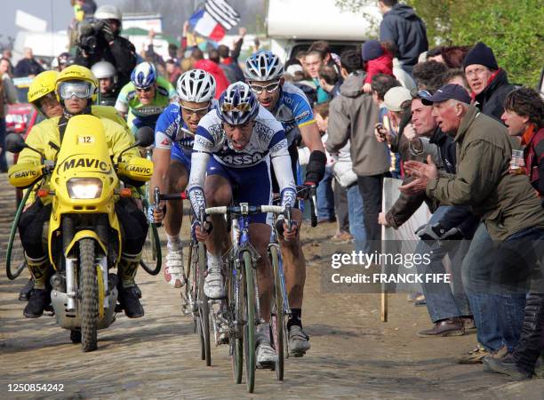 Belgian Tom Boonen , Spanish Juan Antonio Flecha and US George Hincapie ride in the leading pack during the 103rd Paris-Roubaix cycling race, 10...