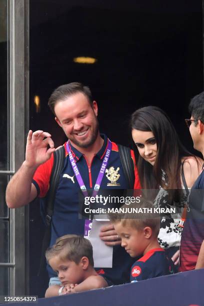 Former Royal Challengers Bangalore player AB de Villiers gestures to spectators before the start of the Indian Premier League Twenty20 cricket match...