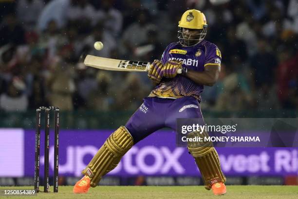 Kolkata Knight Riders' Andre Russell plays a shot during the Indian Premier League Twenty20 cricket match between Punjab Kings and Kolkata Knight...