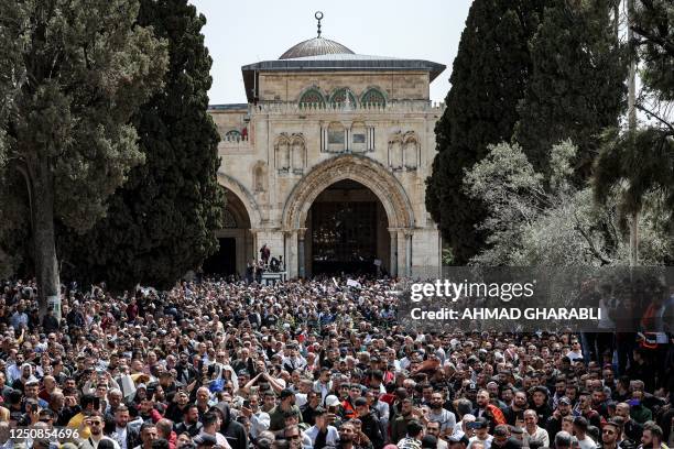 Muslim worshippers gather outside Al-Aqsa Mosque in the holy compound of the same name in the Old City of Jerusalem on April 7, 2023 on the third...