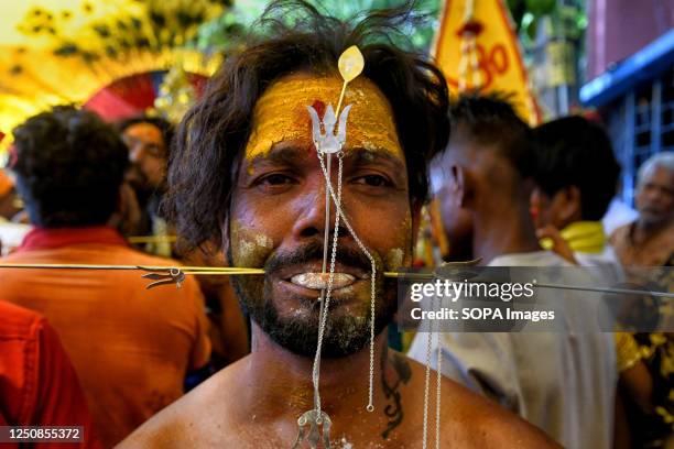 Devotee is seen with their mouth pierced by a vel spear during the Vel Vel religious festival in West Bengal. Velvel is a Hindu festival dedicated to...