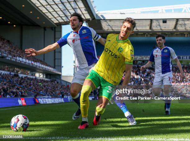 Norwich City's Dimitris Giannoulis shields the ball from Blackburn Rovers' Lewis Travis during the Sky Bet Championship between Blackburn Rovers and...