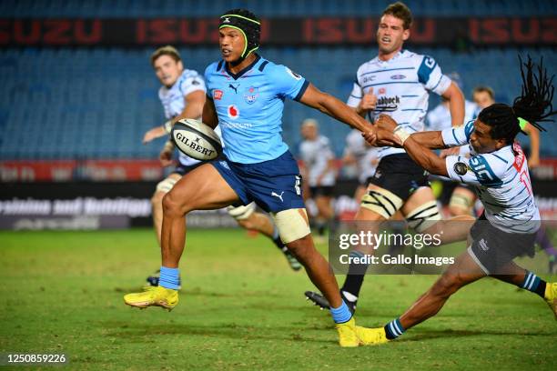 Kurt-Lee Arendse of the Vodacom Bulls fends of Rosko Specman of the Griquas during the Currie Cup, Premier Division match between Vodacom Bulls and...