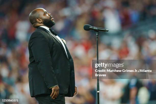 Timothy Miller sings God Bless America during the 7th inning stretch against the San Diego Padres in the Braves season home opener at Truist Park on...