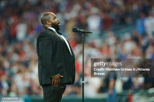 Timothy Miller sings God Bless America during the 7th inning stretch against the San Diego Padres in the Braves season home opener at Truist Park on...