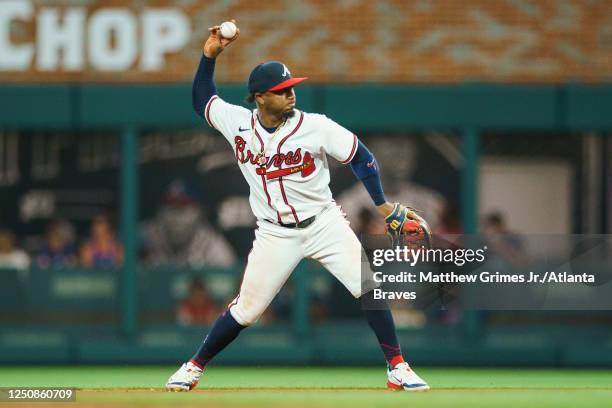 Ozzie Albies of the Atlanta Braves of the Atlanta Braves throws to first during the 7th inning against the San Diego Padres in the Braves season home...