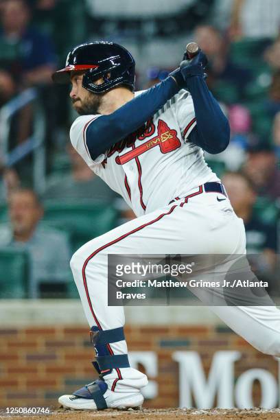 Travis d'Arnaud of the Atlanta Braves hits an RBI single during the 8th inning against the San Diego Padres in the Braves season home opener at...