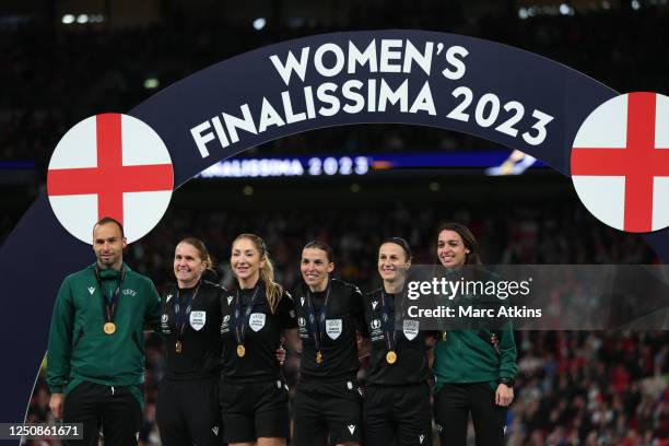 Match officials Jerome Brisard, Elodie Coppola, Manuela Nicolosi, Stephanie Frappart, Esther Staubli and Maika Vanderstichel pose for a photo with...