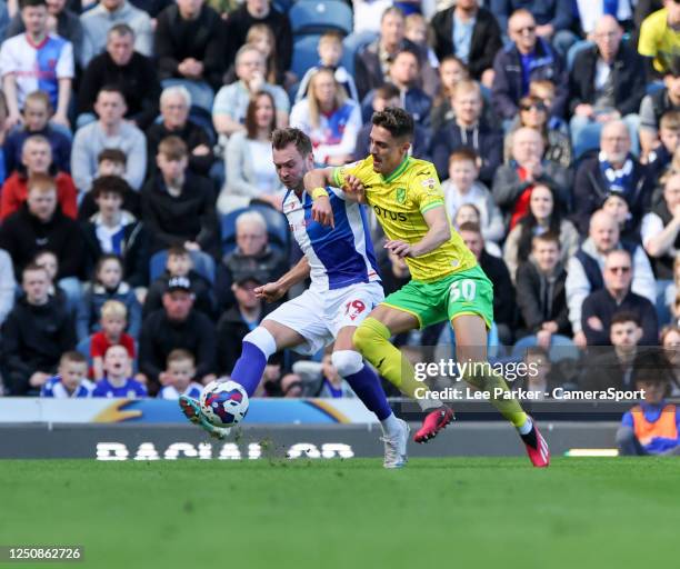 Blackburn Rovers' Ryan Hedges passes the ball despite the attentions of Norwich City's Dimitris Giannoulis during the Sky Bet Championship between...