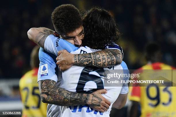 Napoli's Portuguese defender Mario Rui celebrates after Lecce scored an own goal during the Italian Serie A football match between Lecce and Napoli...