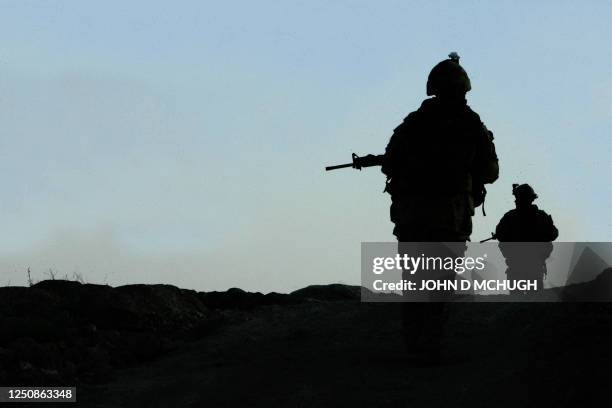 Soldiers from Reconnaissance Platoon, 1st Princess Patricia's Canadian Light Infantry go on patrol at dusk from a Forward Operating Base in Northern...