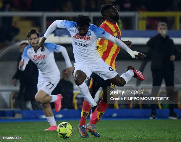 Napoli's Cameroonian midfielder Andre Zambo Anguissa fights for the ball with Lecce's French defender Samuel Umtiti during the Italian Serie A...
