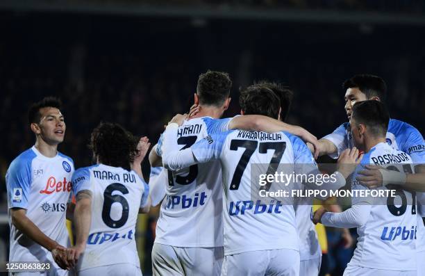 Napoli's Mexican forward Hirving Lozano celebrates with teammates after Lecce scored an own goal during the Italian Serie A football match between...