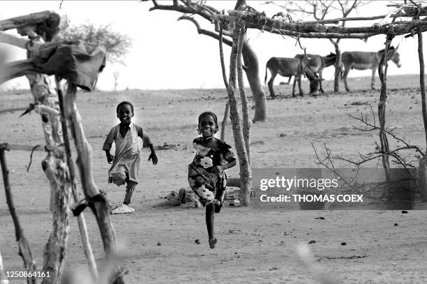 Sudan's children refugees run at the Iridimi refugee camp where 15.000 refugees have fled the Darfur region where rebels attacked the population 26...