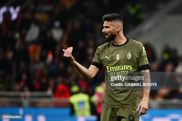 Milan's French forward Olivier Giroud gestures during the Italian Serie A football match between AC Milan and Empoli FC at the San Siro Stadium in...