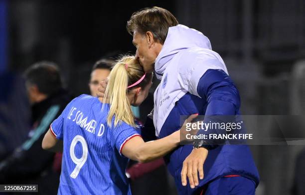 France's forward Eugenie Le Sommer is congratulated by France's head coach Herve Renard after scoring a goal during the women's international...