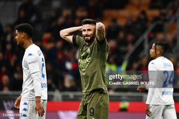 Milan's French forward Olivier Giroud reacts after a goal then disallowed for a handball during the Italian Serie A football match between AC Milan...