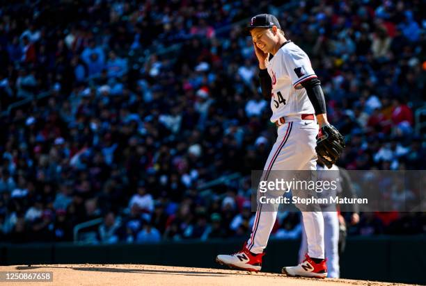 Sonny Gray of the Minnesota Twins reacts after throwing a pitch during the first inning of the home opener against the Houston Astros at Target Field...