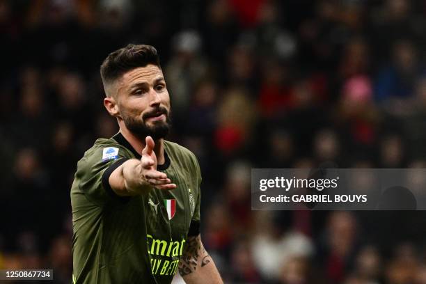 Milan's French forward Olivier Giroud reacts during the Italian Serie A football match between AC Milan and Empoli FC at the San Siro Stadium in...