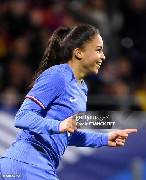 France's forward Delphine Cascarino celebrates after scoring a goal during the women's international friendly football match between France and...