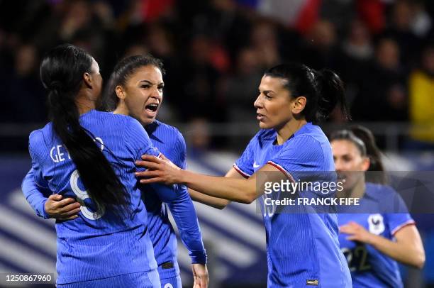 France's forward Delphine Cascarino celebrates with France's midfielder Onema Geyoro after scoring during the women's international friendly football...