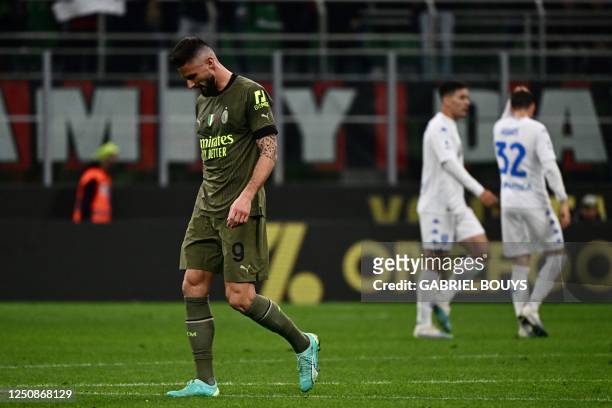 Milan's French forward Olivier Giroud reacts after a draw in the Italian Serie A football match between AC Milan and Empoli FC at the San Siro...