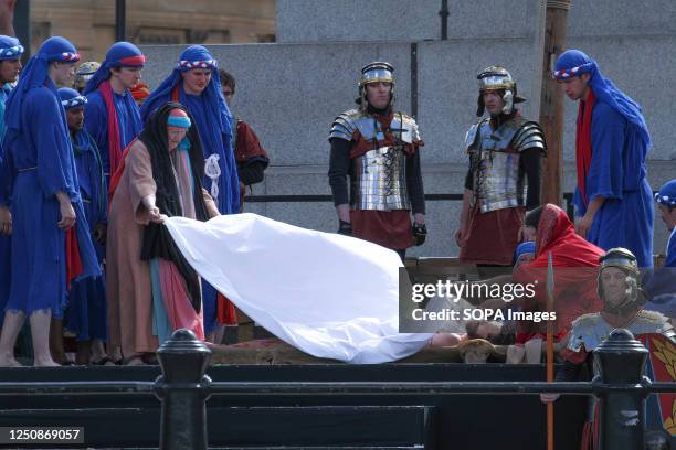 Jessu is covered with a white sheet follwoing his death on the cross. The Wintershall players based in Surrey have for 11 years taken the Passion of...