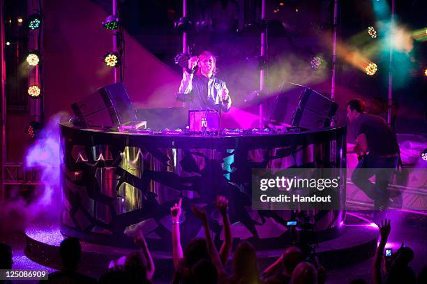 David Guetta performs during Hotel Byblos Summer Party at Hotel Byblos on July 13, 2011 in Saint-Tropez, France.