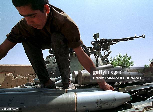 Afcap Tank Shell An Anti-Taliban soldier loads shells onto a tank 18 August in this ...