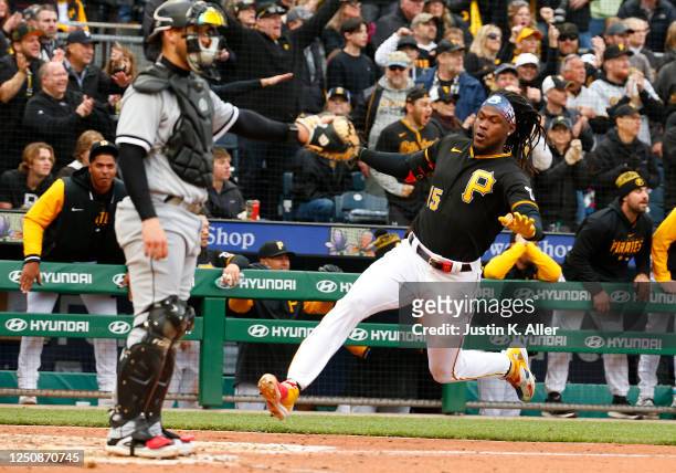 Oneil Cruz of the Pittsburgh Pirates scores on a RBI triple in the fifth inning against the Chicago White Sox during inter-league play on Opening Day...